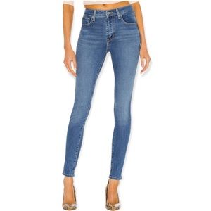 SOLD - Levi’s 721 High Rise Skinny Medium Wash Raw Hem Size 25